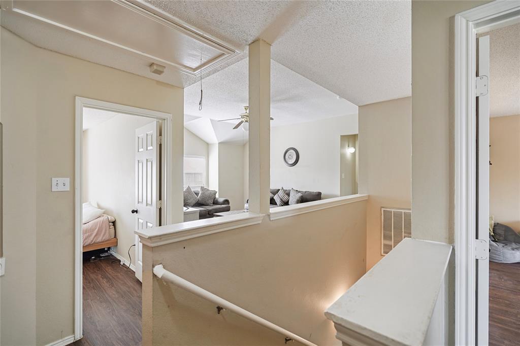 1934 Pin Oak Lane Lancaster, TX 75146 - Photo 27 of 27 a room with a large bed and furniture