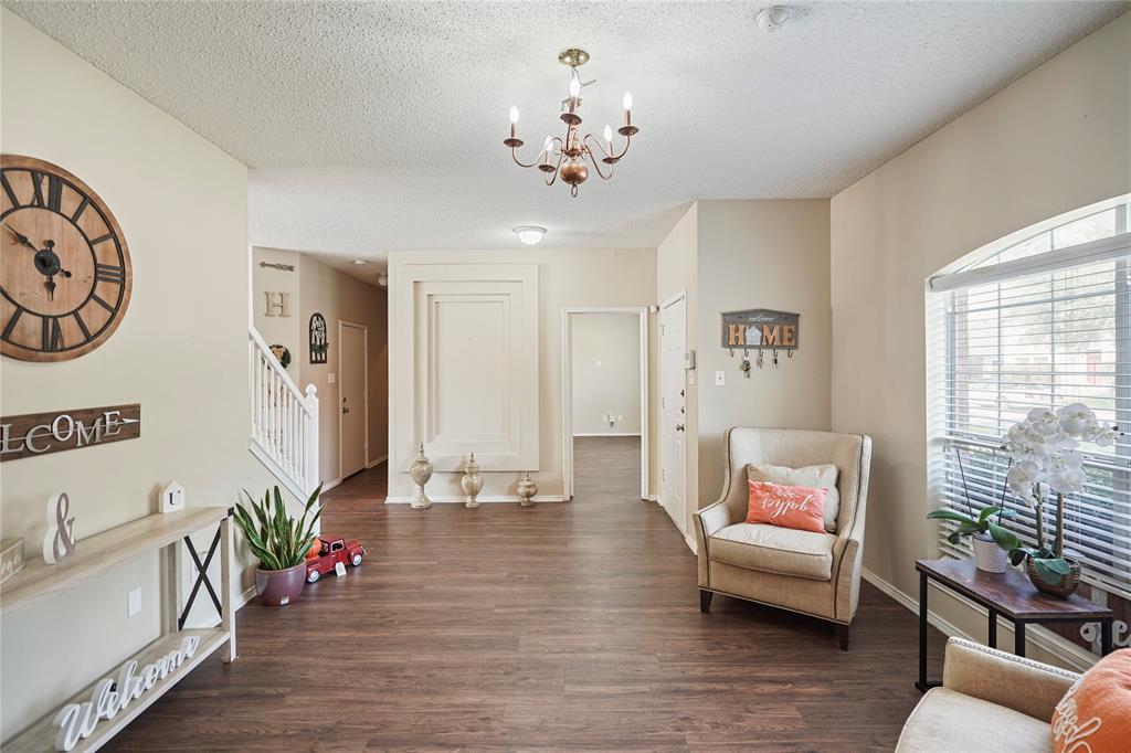 1934 Pin Oak Lane Lancaster, TX 75146 - Photo 3 of 27 a living room with furniture and wooden floor