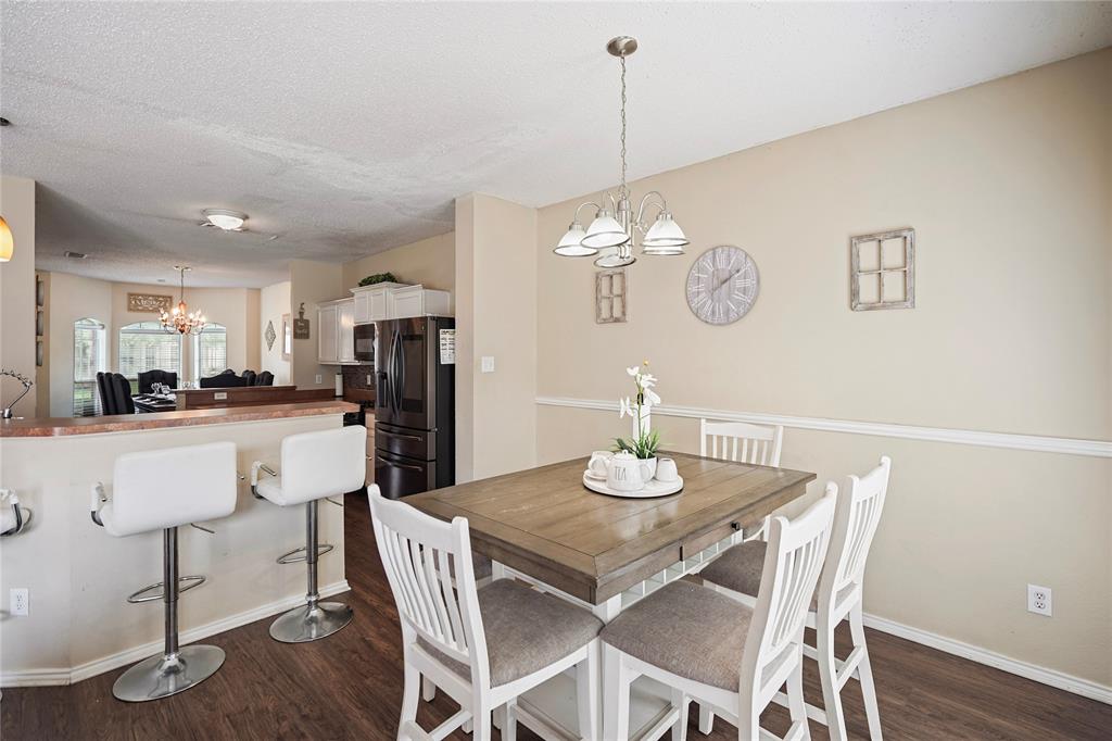 1934 Pin Oak Lane Lancaster, TX 75146 - Photo 9 of 27 a view of a dining room with furniture