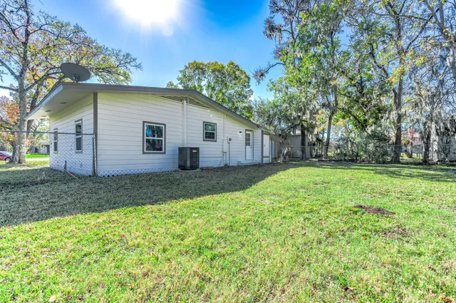 a view of a house with yard and a garden