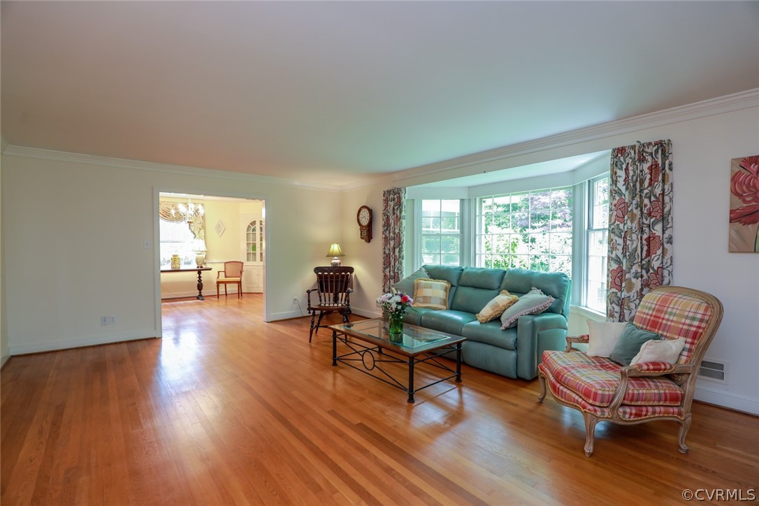 4317 Wakefield Road Richmond, VA 23235 - Photo 3 of 43 a living room with furniture and a wooden floor