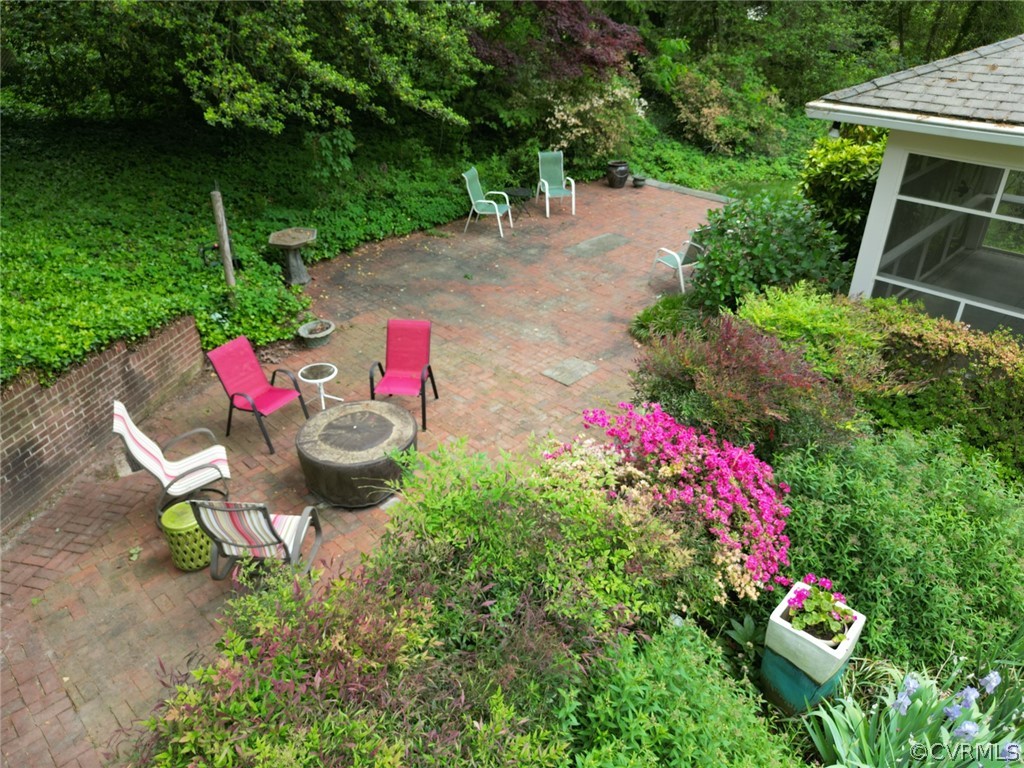 4317 Wakefield Road Richmond, VA 23235 - Photo 34 of 43 a view of a backyard with table and chairs and potted plants