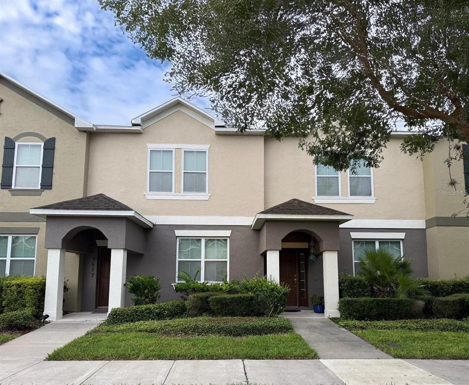 7621 Sutherton Lane Windermere, FL 34786 - Photo 2 of 15 a front view of a house with garden