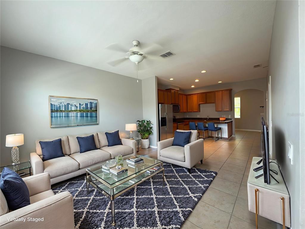 7621 Sutherton Lane Windermere, FL 34786 - Photo 3 of 15 a living room with furniture and a view of kitchen