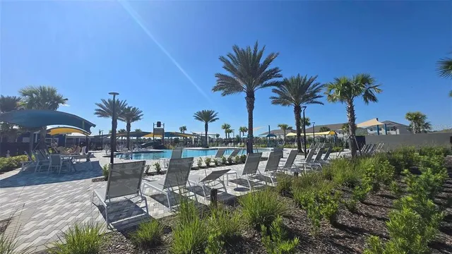 a view of a chair and tables in patio