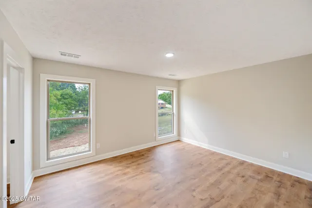 an empty room with windows