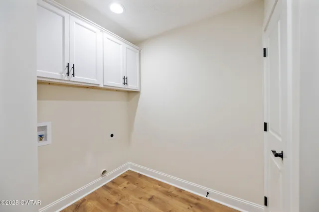 a view of a kitchen with wooden floor