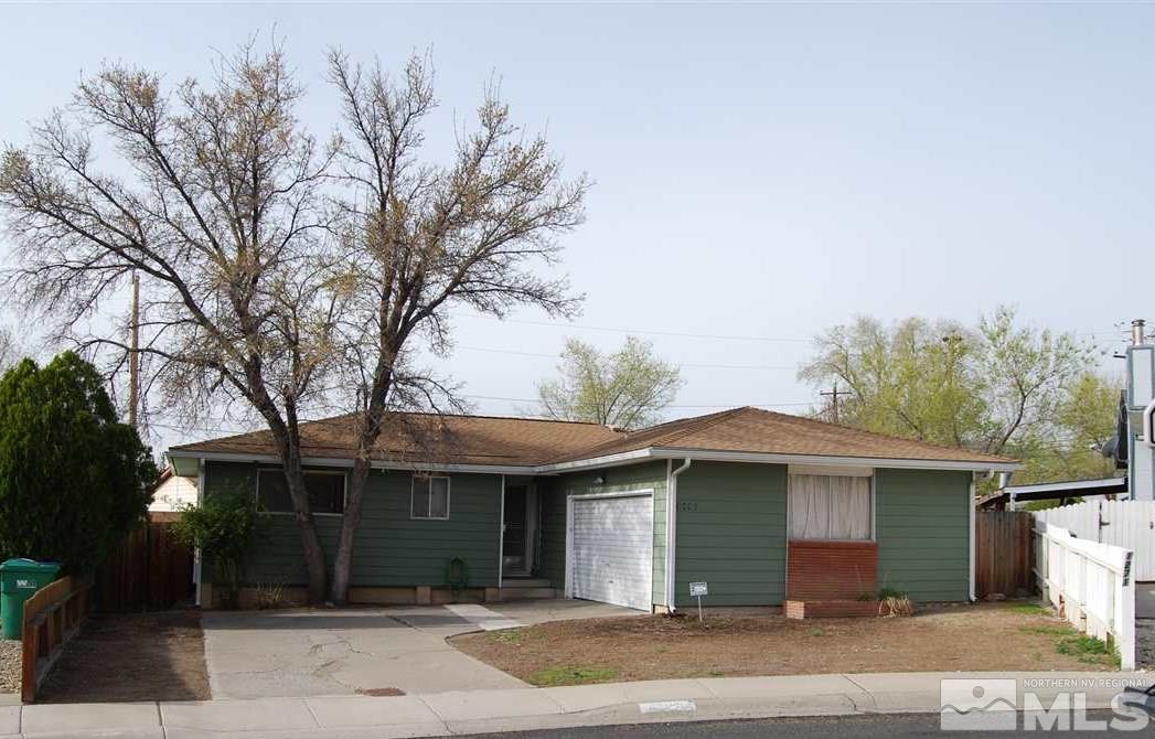 3090 Accacia Way Reno, NV 89503 - Photo 1 of 5 a front view of a house with a yard