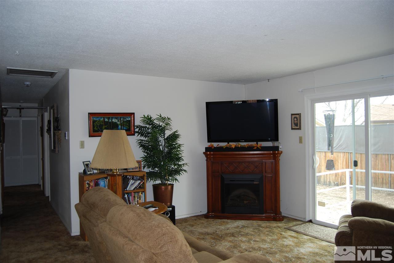 3090 Accacia Way Reno, NV 89503 - Photo 2 of 5 a living room with furniture and a flat screen tv
