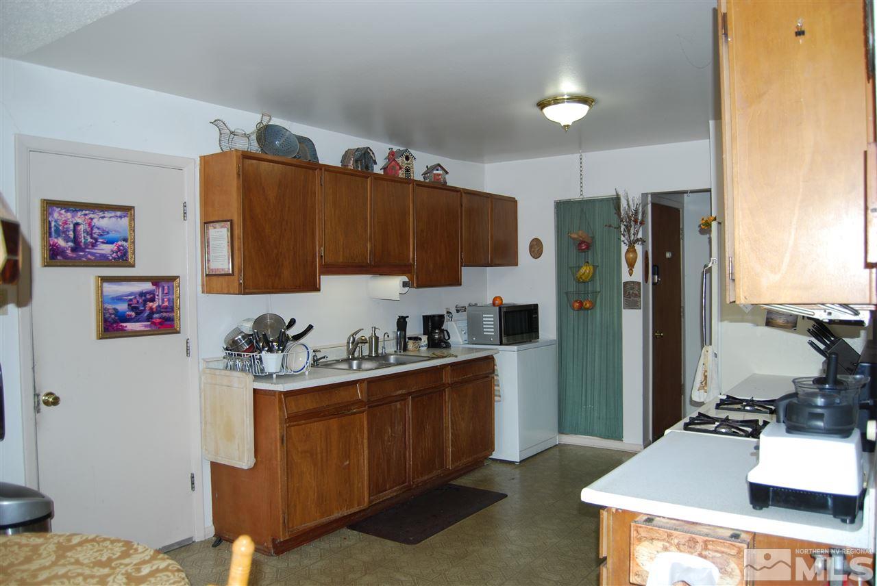 3090 Accacia Way Reno, NV 89503 - Photo 4 of 5 a kitchen with a refrigerator and a stove top oven