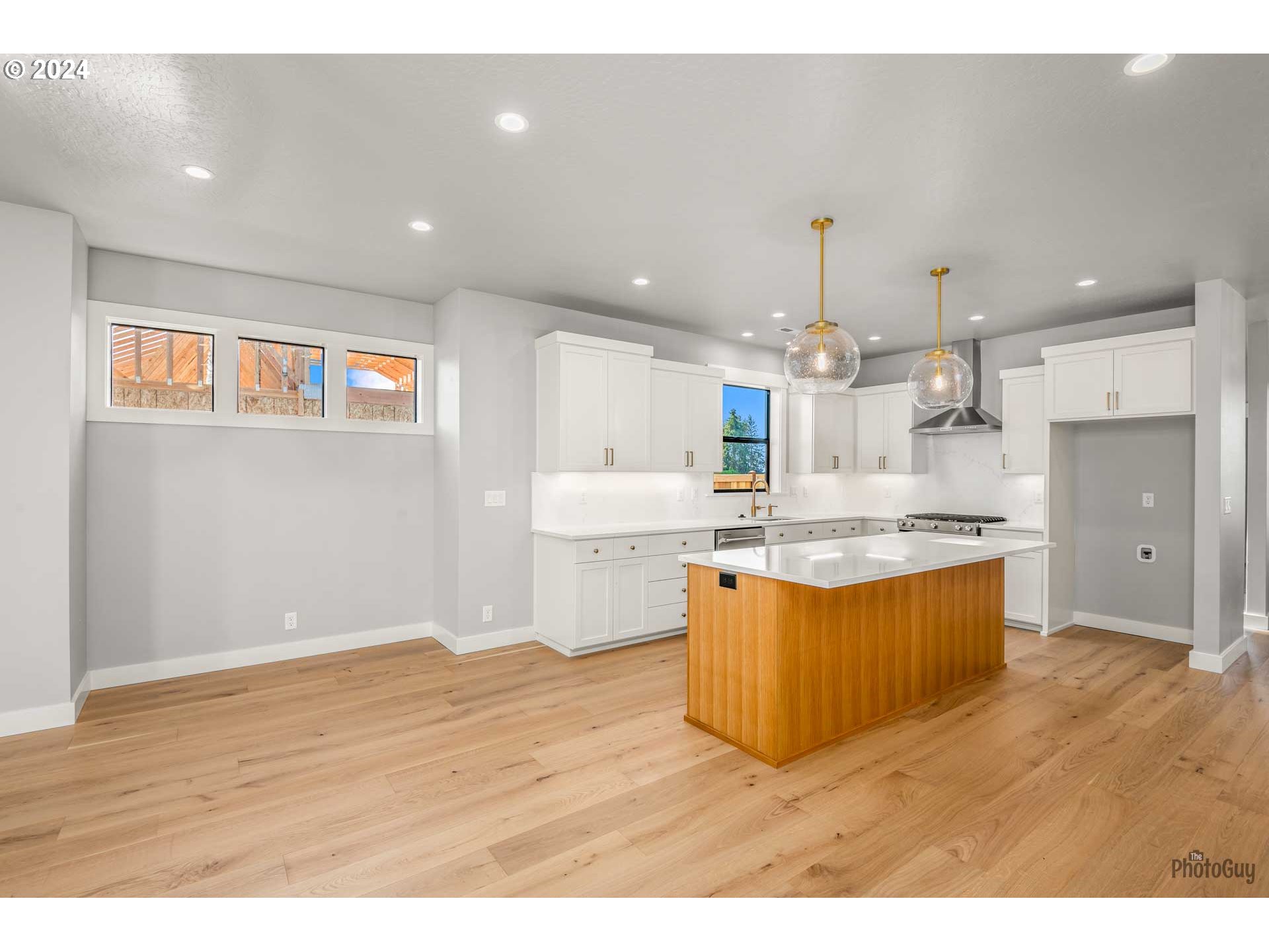 32748 Coburg Road Eugene, OR 97408 - Photo 11 of 35 a large kitchen with granite countertop a large counter top and stainless steel appliances