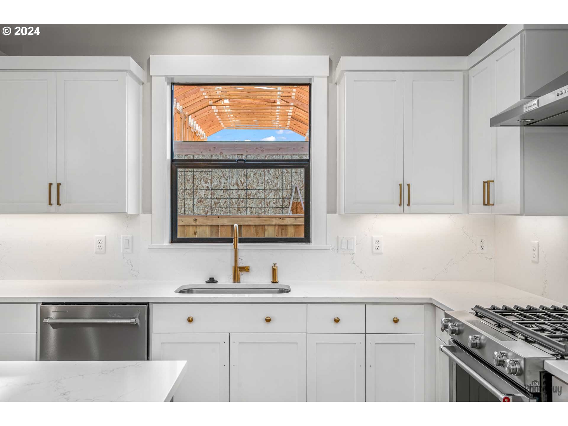 32748 Coburg Road Eugene, OR 97408 - Photo 13 of 35 a kitchen with stainless steel appliances a sink stove and cabinets