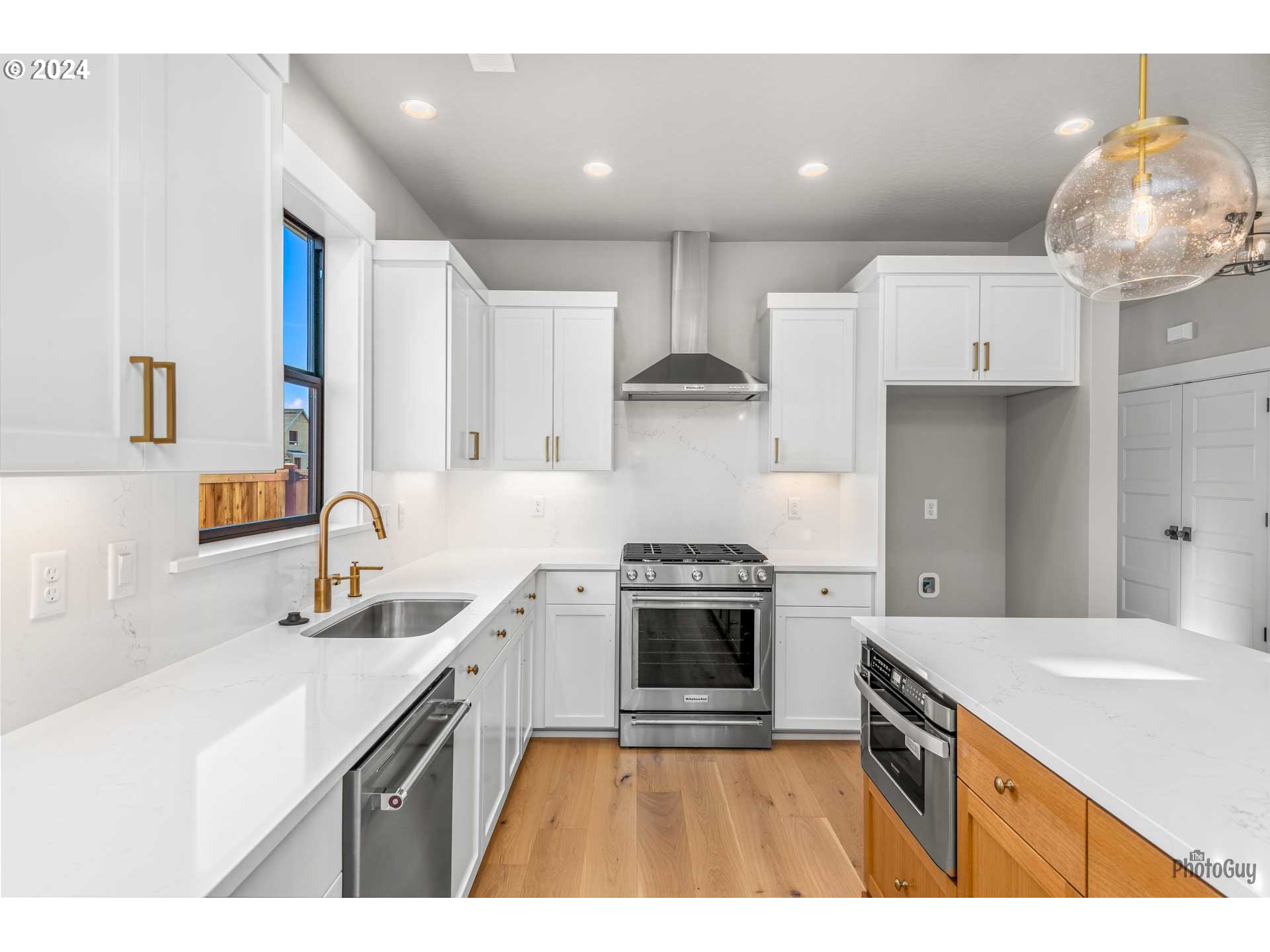 32748 Coburg Road Eugene, OR 97408 - Photo 14 of 35 a kitchen that has a sink a stove and cabinets