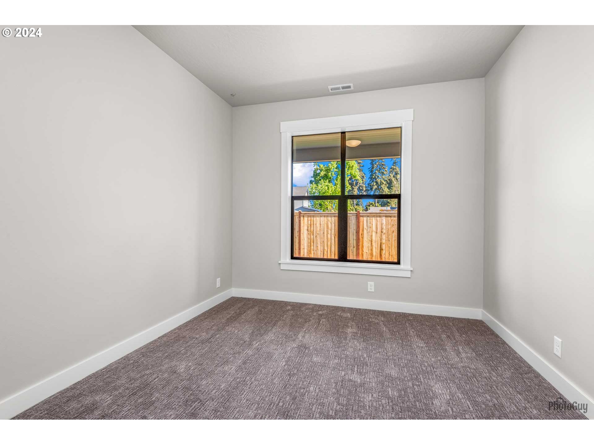 32748 Coburg Road Eugene, OR 97408 - Photo 21 of 35 a view of an empty room with a window