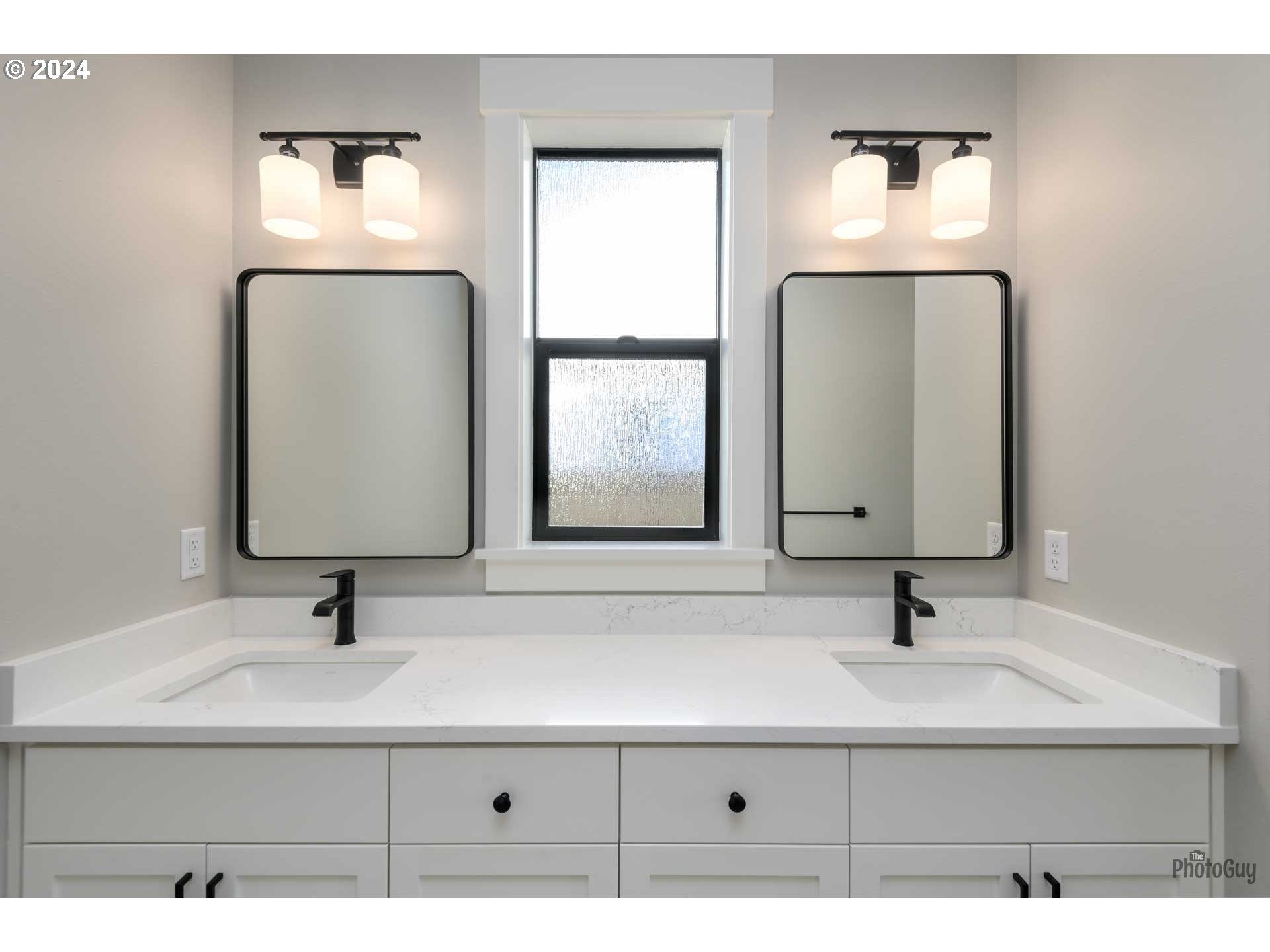 32748 Coburg Road Eugene, OR 97408 - Photo 27 of 35 a bathroom with a sink and a mirror