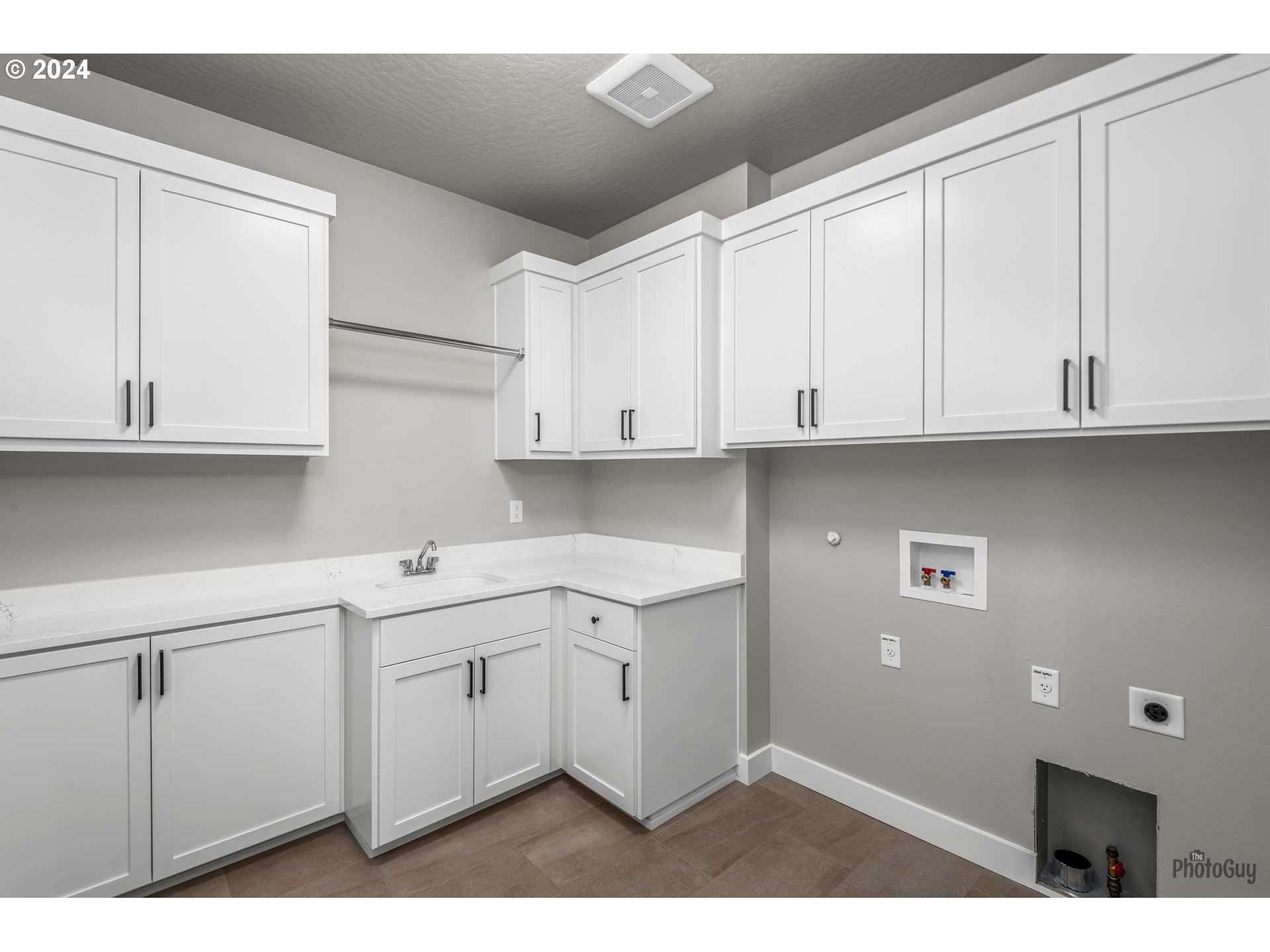 32748 Coburg Road Eugene, OR 97408 - Photo 30 of 35 a kitchen with white cabinets
