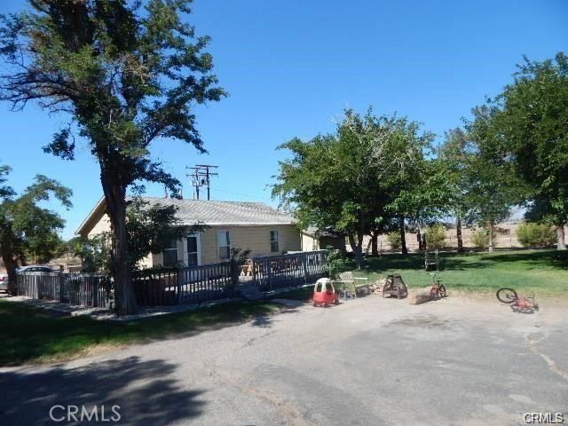 19968 Bear Valley Road Apple Valley, CA 92308 - Photo 3 of 20 a view of swimming pool and trees in the background