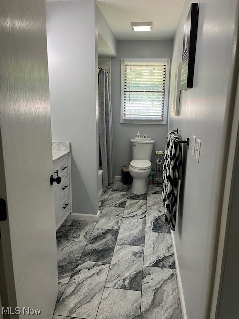 5795 Merwin Chase Road Brookfield, OH 44403 - Photo 23 of 39 Full bathroom with marble look tiles, vanity, and shower / bathtub combination with curtain