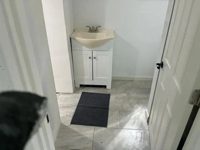 a bathroom with a sink and a mirror