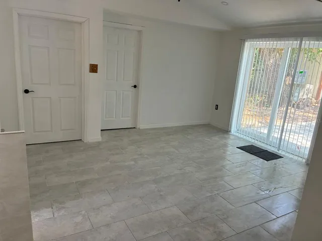 a view of an empty room and window