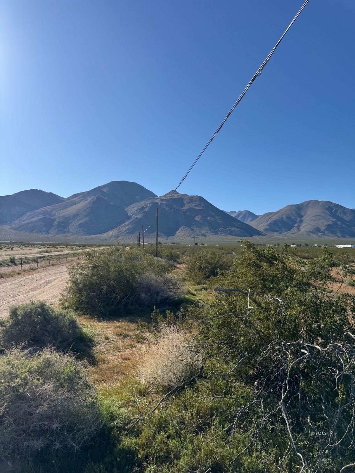 Pearson Road Inyokern, CA 93527 - Photo 6 of 8 a view of a lush green field with mountains in the background