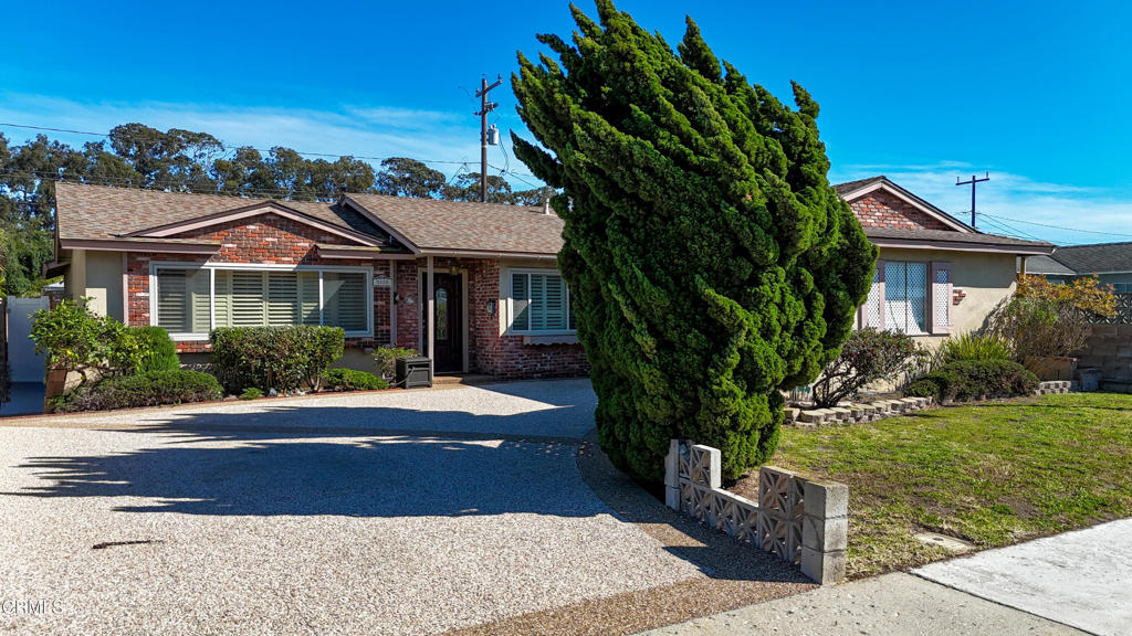 3820 South J Street Oxnard, CA 93033 - Photo 1 of 1 a front view of a house with a yard