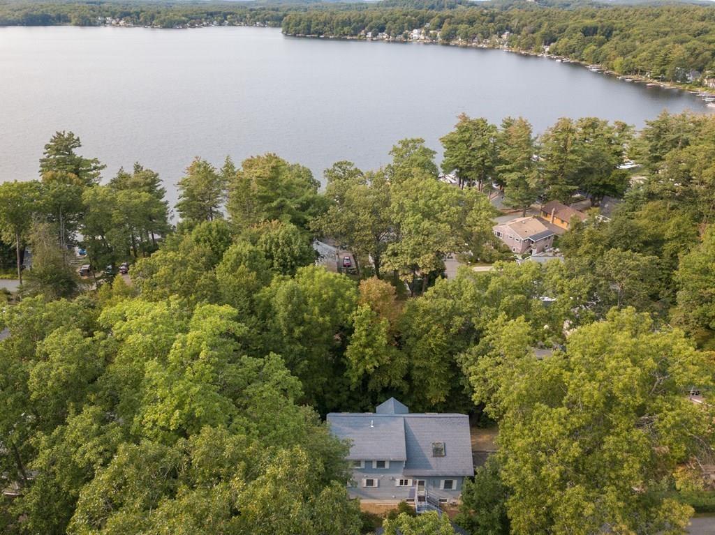 24 1st Street Amesbury, MA 01913 - Photo 2 of 42 an aerial view of a house with a yard and lake view
