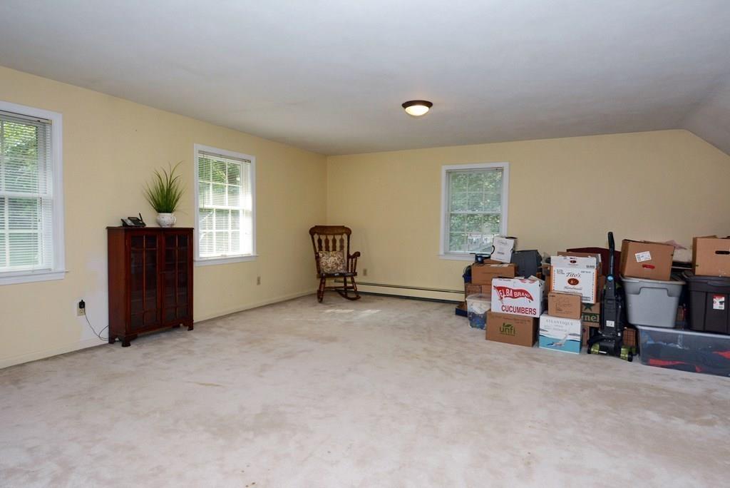 24 1st Street Amesbury, MA 01913 - Photo 22 of 42 a view of a livingroom with furniture and a window