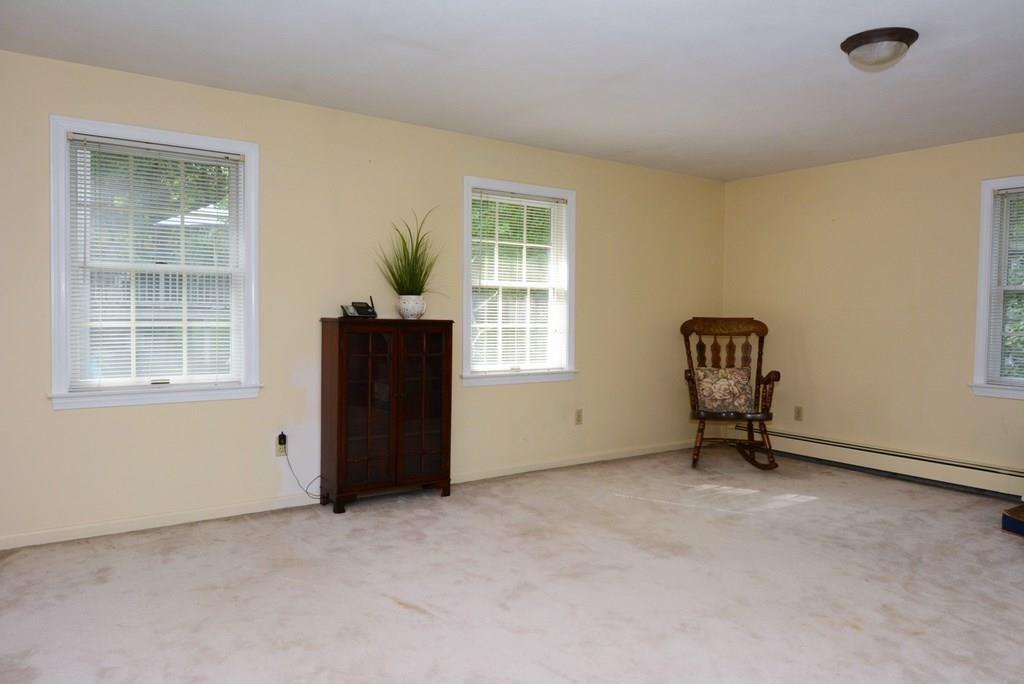 24 1st Street Amesbury, MA 01913 - Photo 23 of 42 an empty room with windows and closet