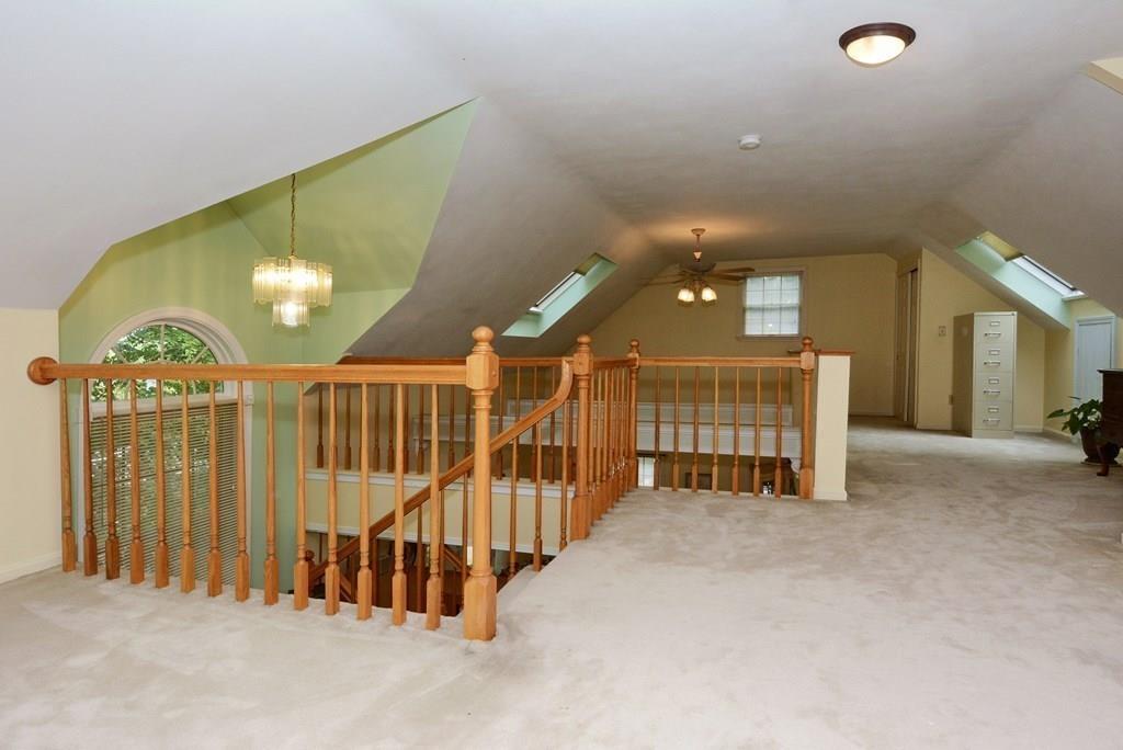 24 1st Street Amesbury, MA 01913 - Photo 25 of 42 a view of a livingroom with furniture and stairs