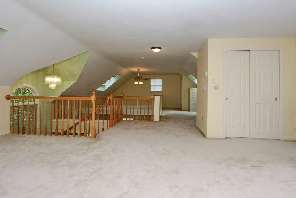 24 1st Street Amesbury, MA 01913 - Photo 27 of 42 a view of a hallway with stairs