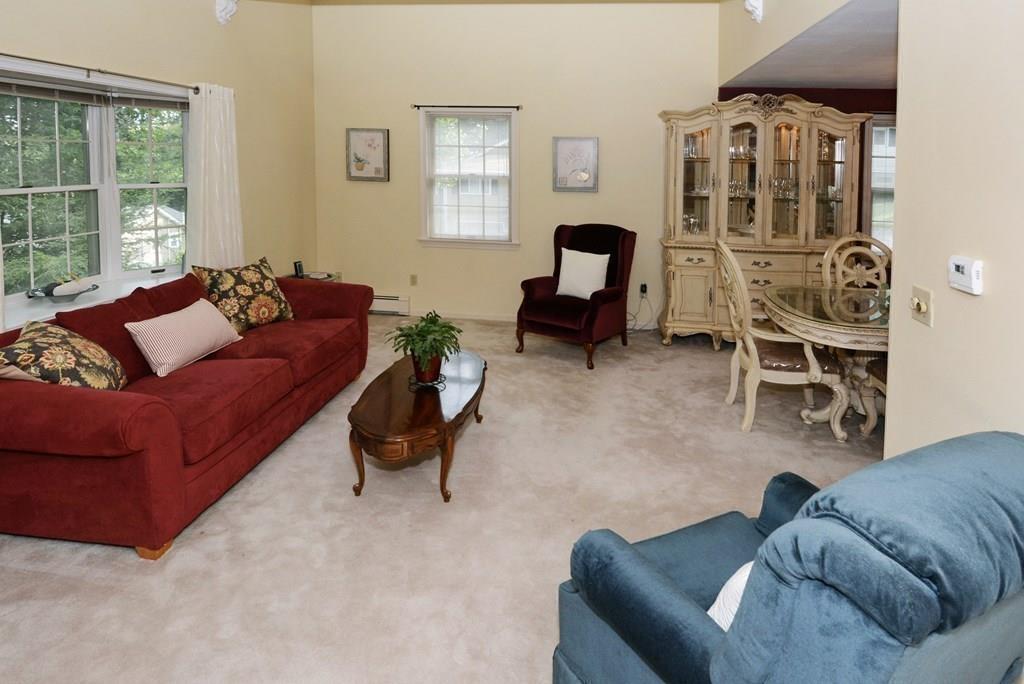 24 1st Street Amesbury, MA 01913 - Photo 3 of 42 a living room with furniture and a window