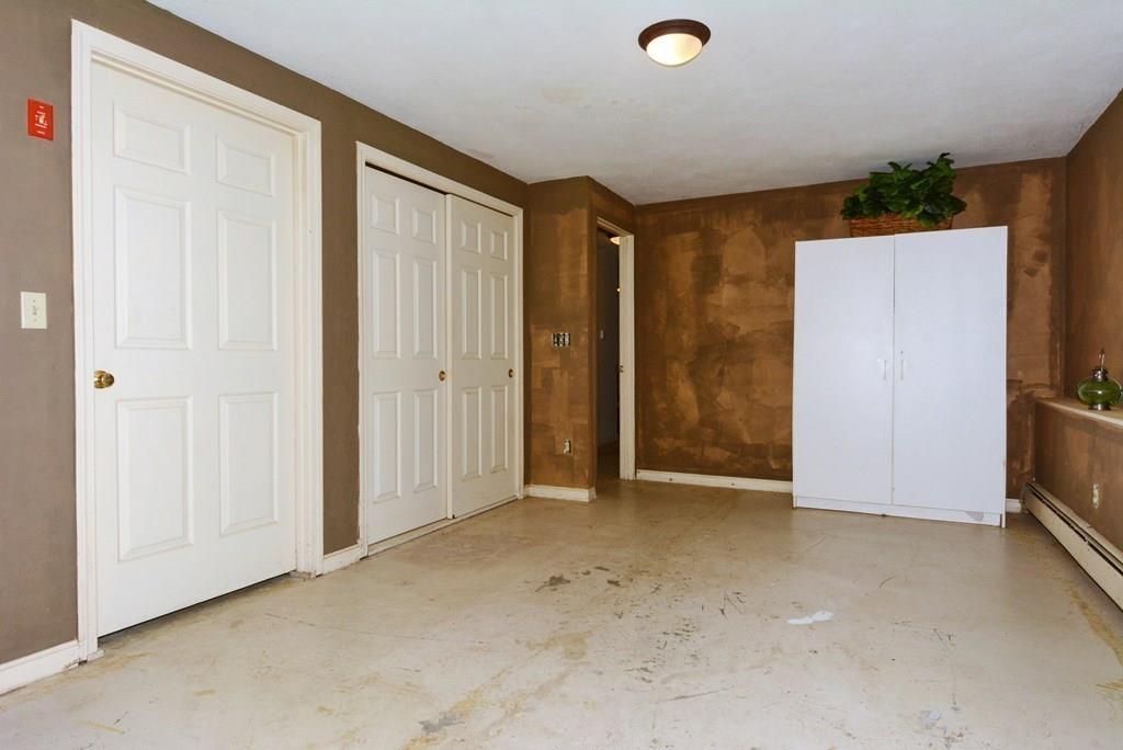 24 1st Street Amesbury, MA 01913 - Photo 31 of 42 an empty room with closet and a window