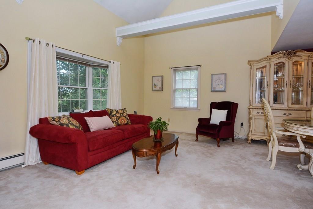24 1st Street Amesbury, MA 01913 - Photo 34 of 42 a living room with furniture and a window