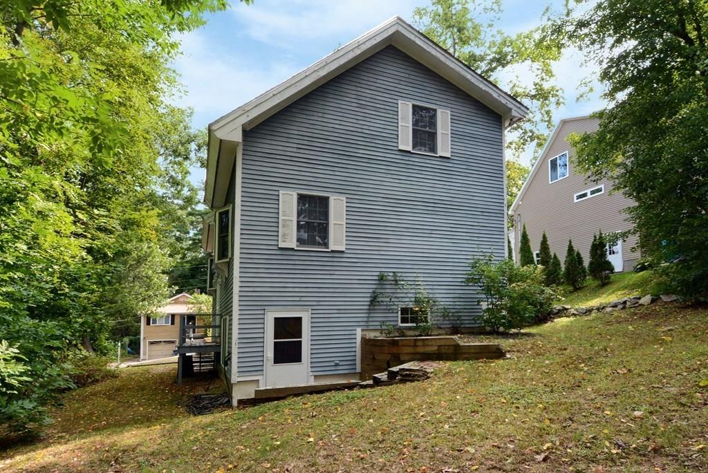 24 1st Street Amesbury, MA 01913 - Photo 36 of 42 a front view of a house with a yard