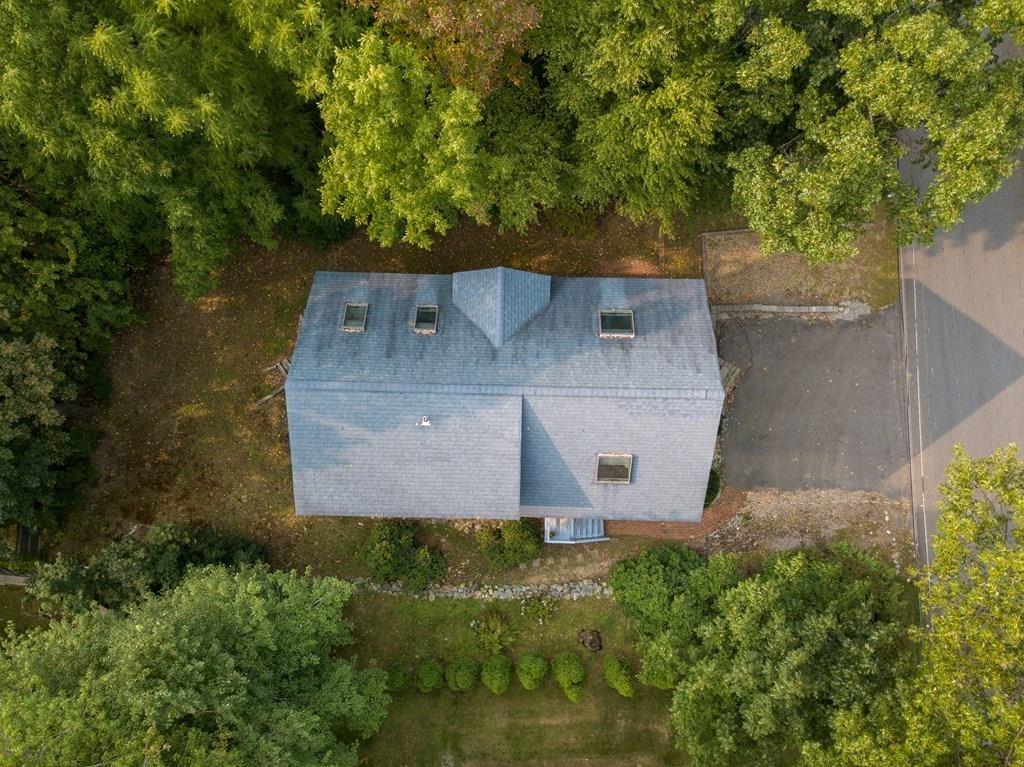 24 1st Street Amesbury, MA 01913 - Photo 37 of 42 an aerial view of a house with a yard