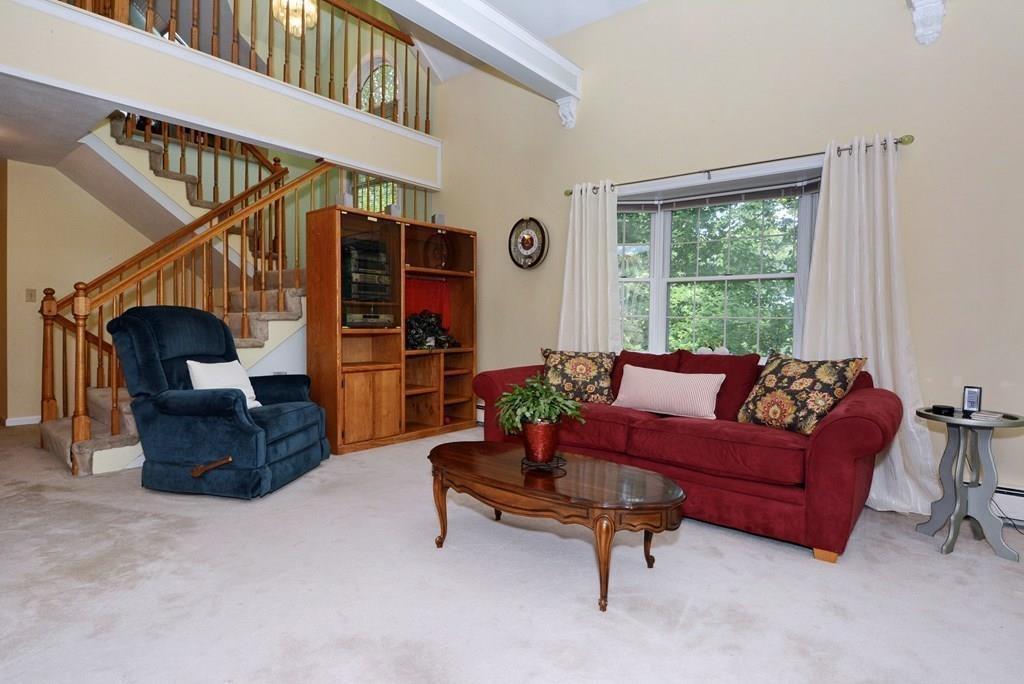 24 1st Street Amesbury, MA 01913 - Photo 4 of 42 a living room with furniture and a window