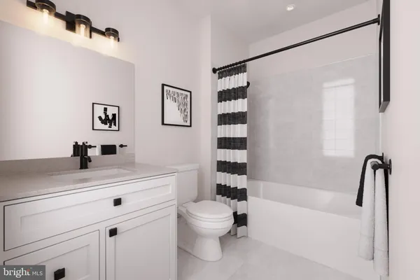 a bathroom with a sink a toilet and a bathtub