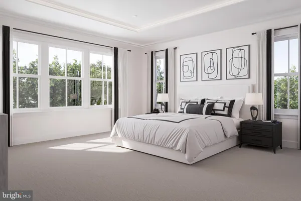 a bedroom with a large bed and a large window