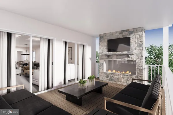 a living room with fireplace furniture and a flat screen tv