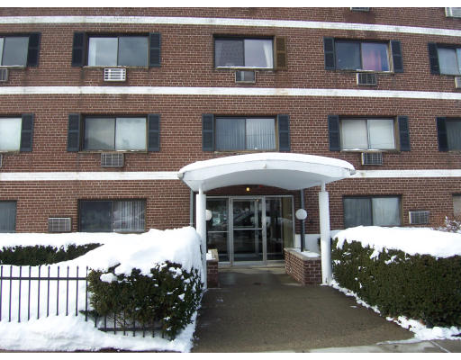 35 Glencoe Street, Unit 43 Boston, MA 02135 - Photo 1 of 19 a front view of a house with a yard