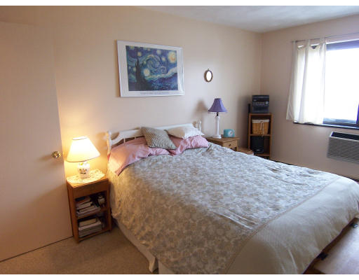 35 Glencoe Street, Unit 43 Boston, MA 02135 - Photo 3 of 19 a bedroom with a bed and a window