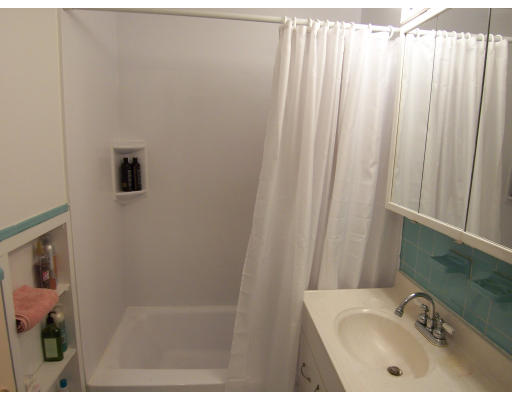 35 Glencoe Street, Unit 43 Boston, MA 02135 - Photo 6 of 19 a bathroom with a sink a mirror and a shower