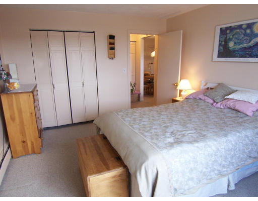 35 Glencoe Street, Unit 43 Boston, MA 02135 - Photo 10 of 19 a bedroom with a bed and a mirror