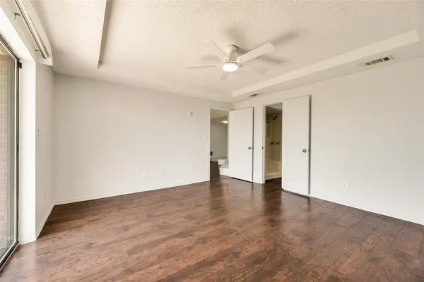 a bathroom with a glass shower door