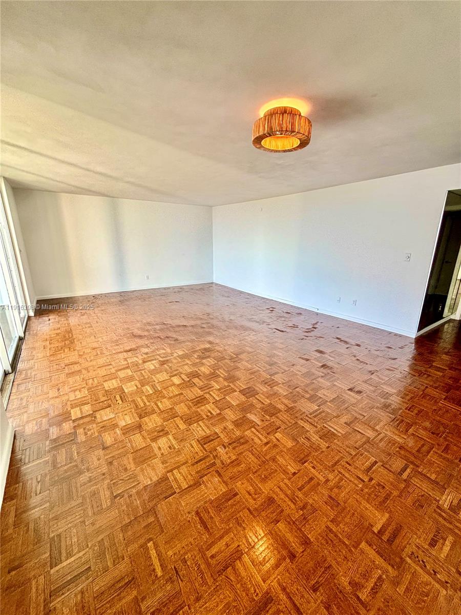 609 Ocean Drive, Unit 10H Key Biscayne, FL 33149 - Photo 13 of 21 a view of empty room with window and ceiling fan