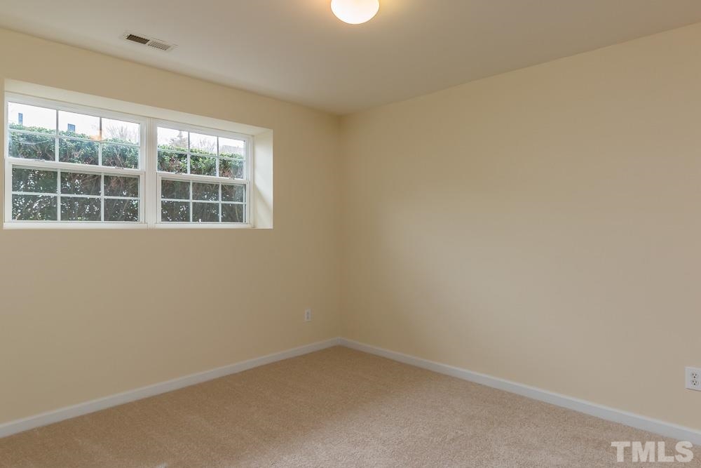 2910 Barrymore Street, Unit 101 Raleigh, NC 27603 - Photo 22 of 24 Lower Level Bedroom has Sunny Windows with a Wide Sill Perfect for Decorating