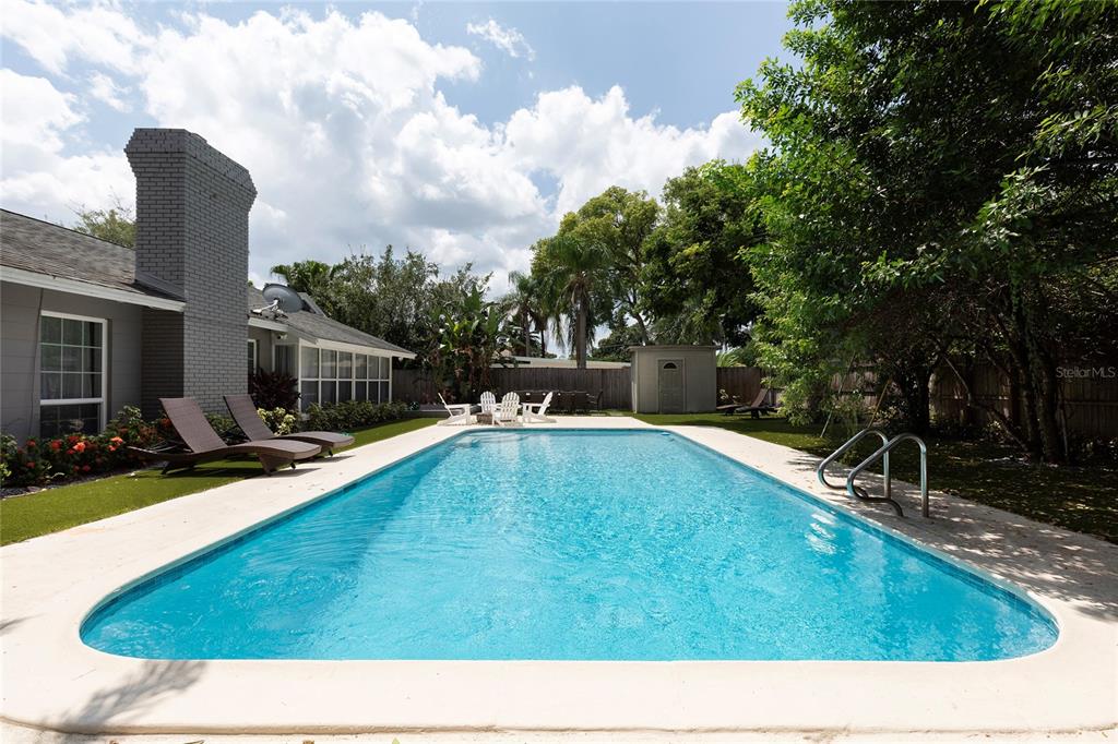 5233 Lake Howell Road Winter Park, FL 32792 - Photo 1 of 21 a view of a swimming pool with a patio