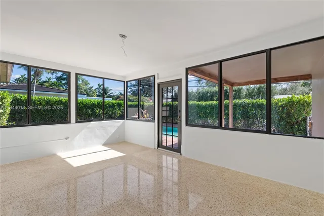 a view of an empty room with a large window