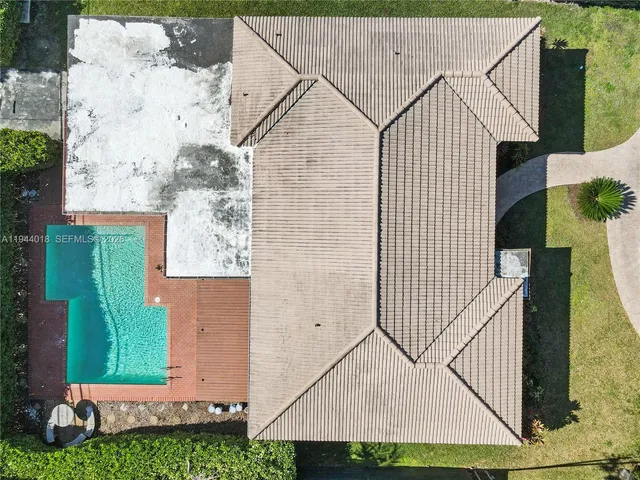an aerial view of residential houses with city view